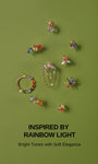 Ear stacking layered look with full KOSINER rainbow cz cartilage collection, colorful pear cluster flat back studs and clicker hoops multi piercing styling