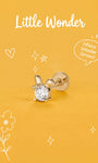 Little Wonder 14K solid gold rabbit flat back stud on an orange background
