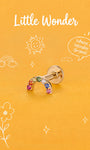 Little Wonder 14K solid gold rainbow flat back stud on an orange background