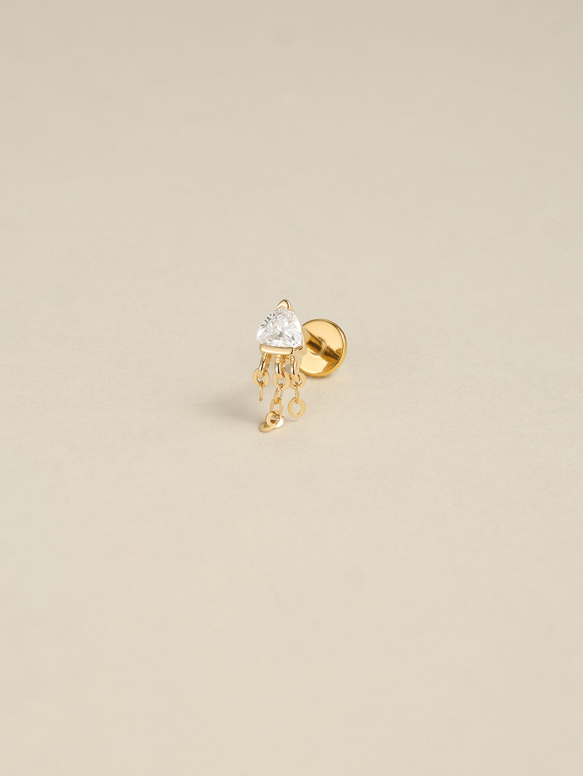 14K solid gold triangle tassel flat back stud, trillion cut cubic zirconia dangle cartilage earring, KOSINER gold piercing jewelry on neutral beige background