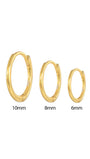 Set of three 18K gold plated sterling silver huggie hoop earrings in 10mm, 8mm, and 6mm sizes.