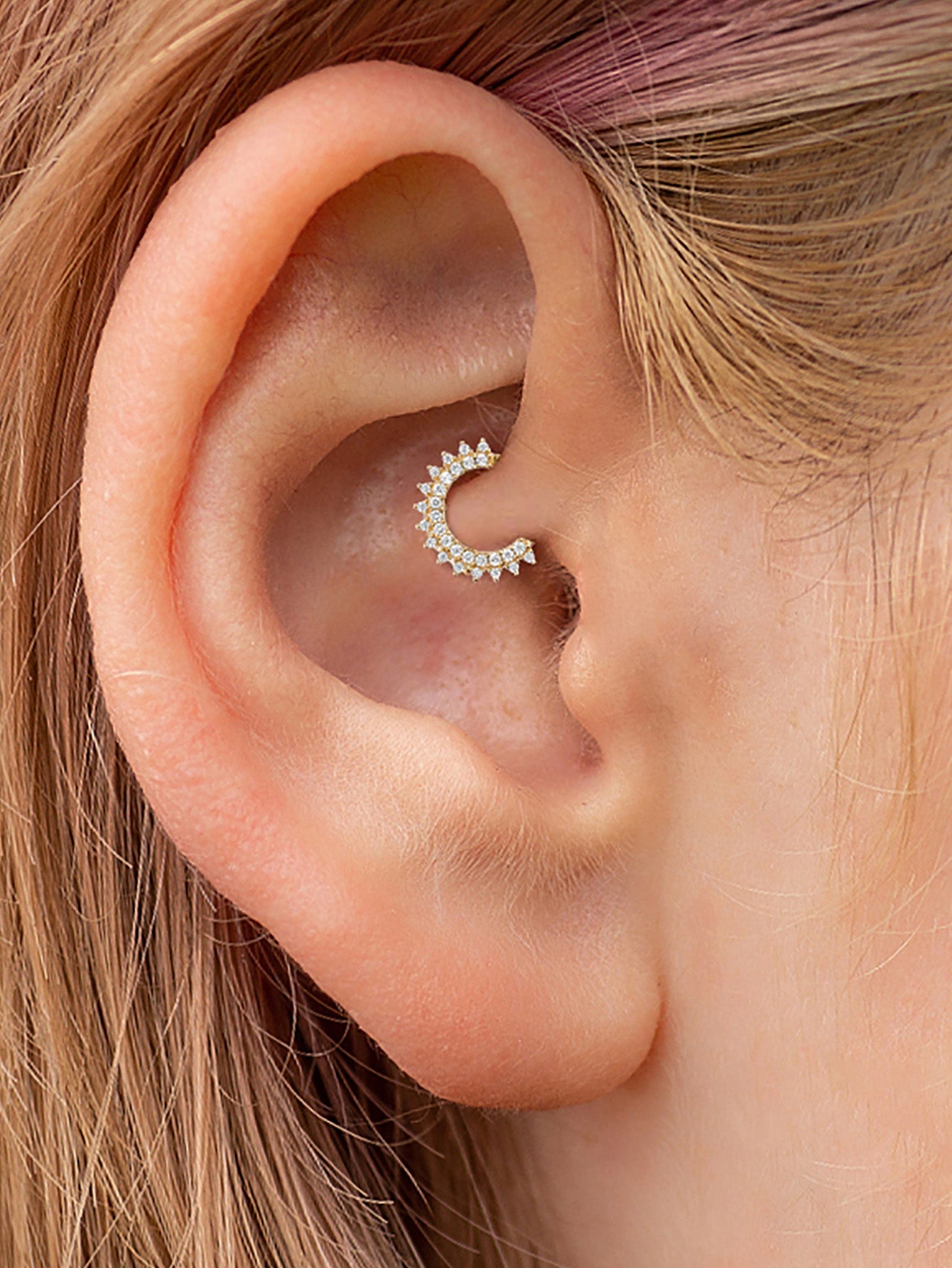 18K gold plated sterling silver daith piercing jewelry with double row of cubic zirconia stones on ear.