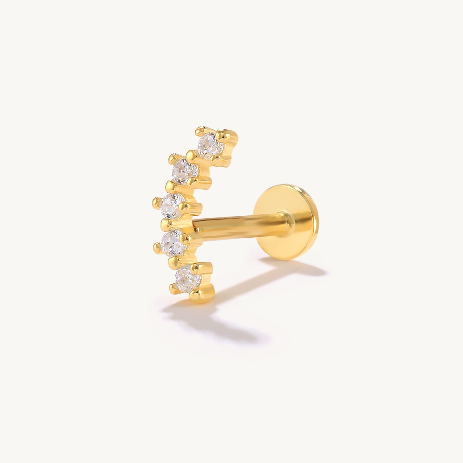 Gold-plated sterling silver flat back threaded labret ear piercing stud with five curved cubic zirconia stones.