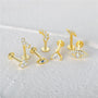 Gold-plated sterling silver CZ ear studs: arch, lightning, triangle, evil eye. Internally threaded labrets for piercings.