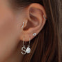18kt gold plated sterling silver threaded ear stud with five sparkling CZ stones in an arch, worn in helix piercing.