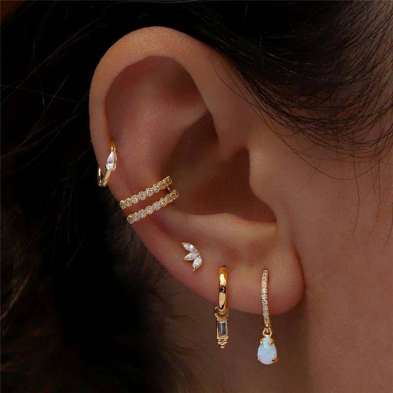 Curated ear stack with gold 925 sterling silver earrings featuring cubic zirconia and gemstone drops.