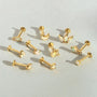 Collection of 18k gold plated sterling silver flat back labret piercings with cubic zirconia stones in various shapes.