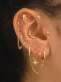 Gold 925 sterling silver ear piercings with cubic zirconia: marquise arch, starburst, lightning bolt, chain earrings.