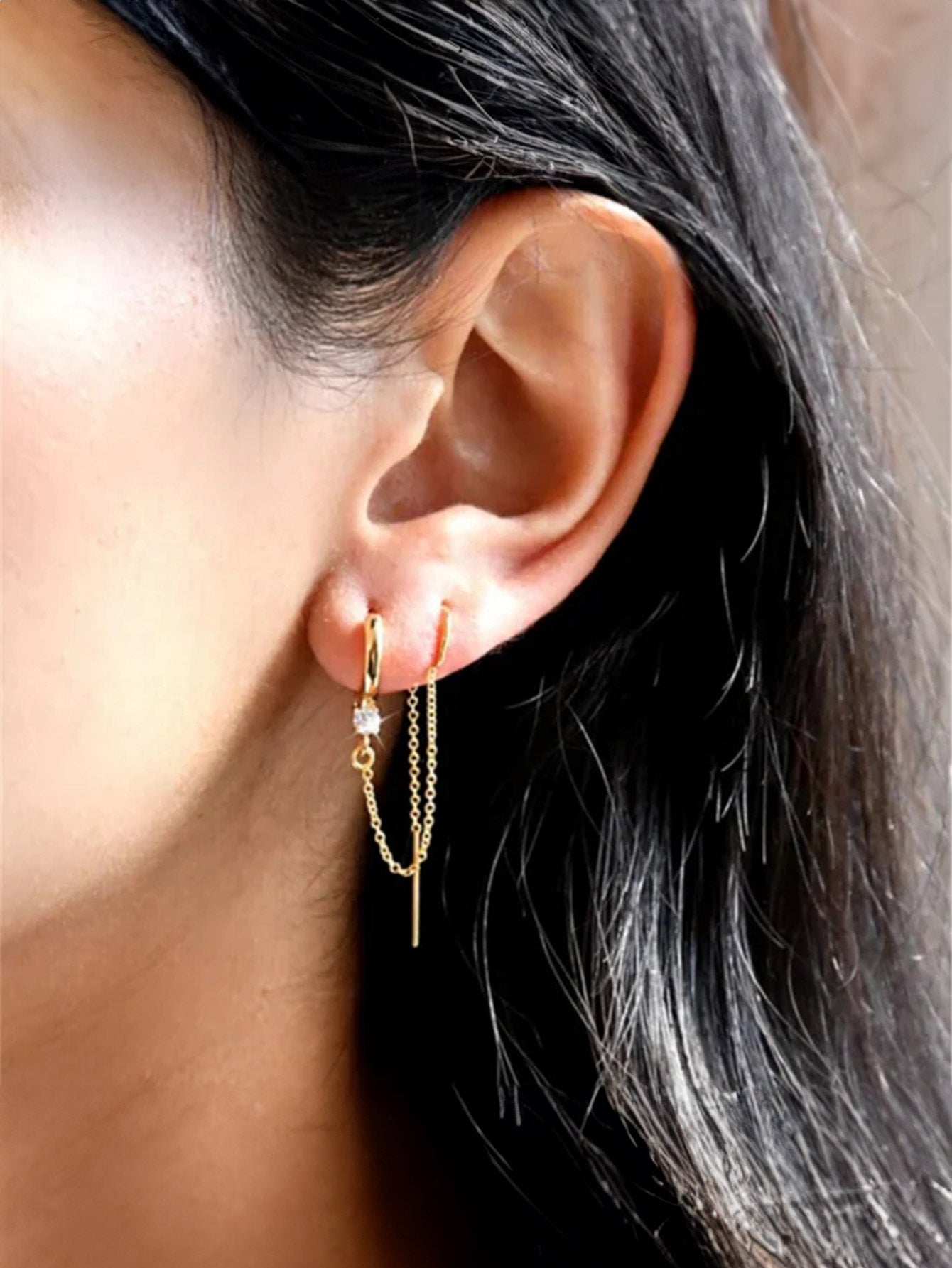 18k gold plated sterling silver threader earrings with cubic zirconia and linear bar drop on ear.