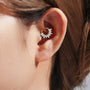 Gold plated sterling silver daith earring with pave marquise cubic zirconia in a fan design on model's ear.