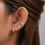 Sterling silver 3-piece earring set: two butterfly studs and a small CZ hoop worn on ear.