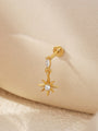 18kt gold plated 925 sterling silver labret stud with starburst charm and cubic zirconia, shown on ear.