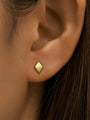 18kt gold plated sterling silver rhombus stud earring, 16G, flat back labret, worn on ear.