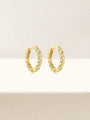 18K gold-plated sterling silver huggie hoop earrings with twisted rope detail and cubic zirconia accents.