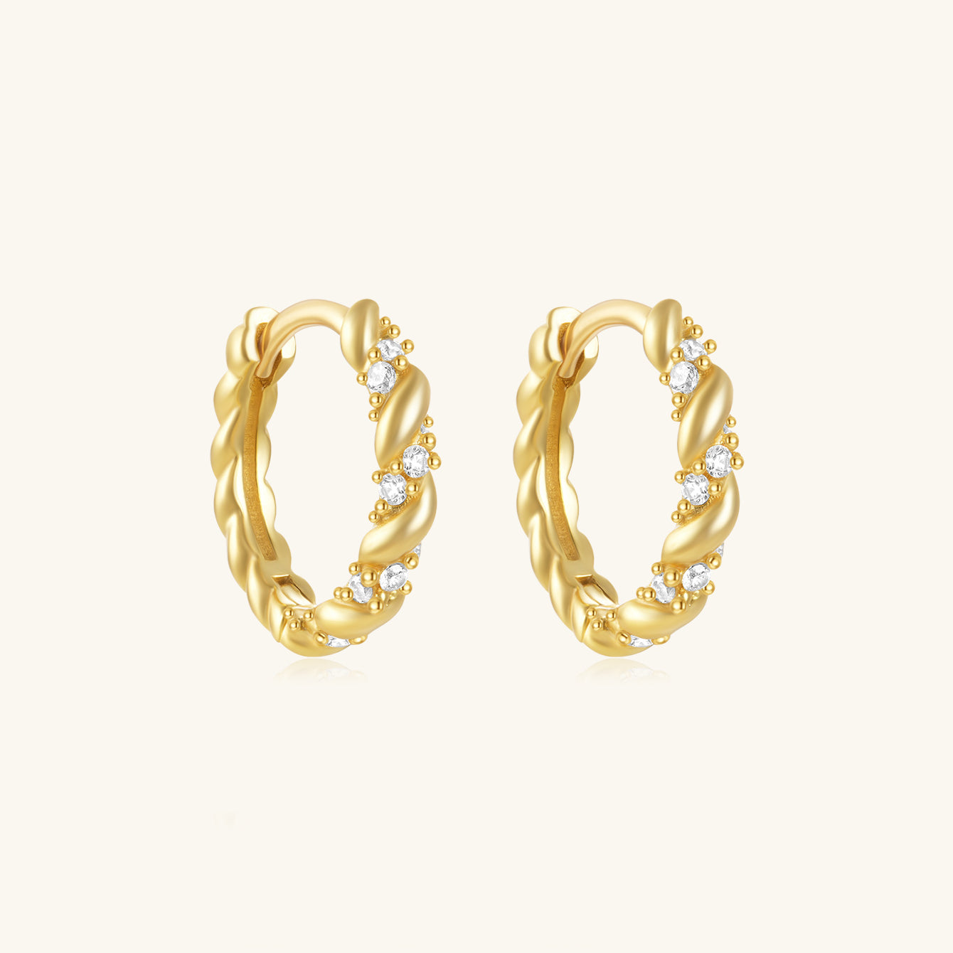 18K gold-plated 925 sterling silver huggie hoop earrings with twisted rope design and cubic zirconia.