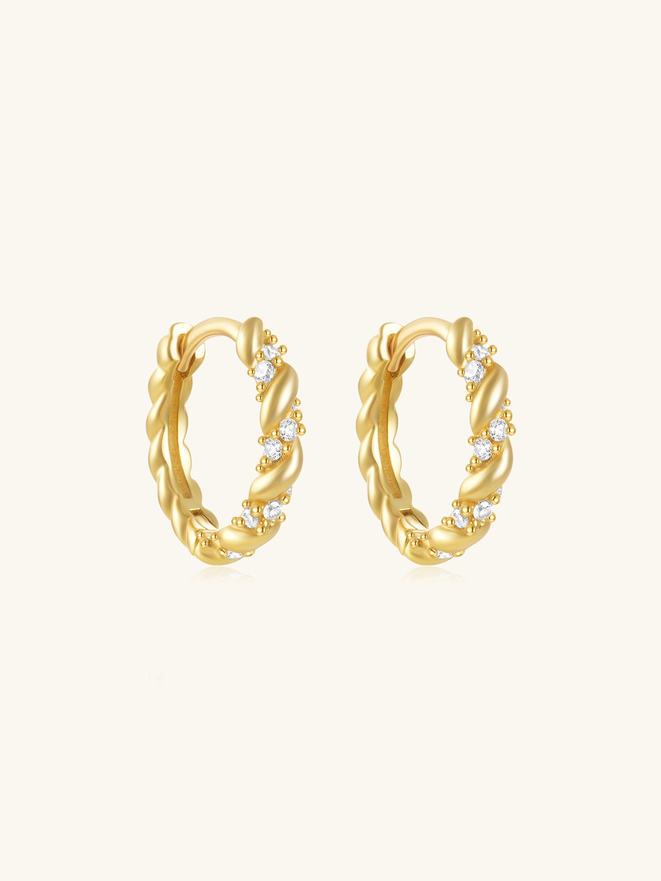 18K gold-plated 925 sterling silver huggie hoop earrings with twisted rope design and cubic zirconia.