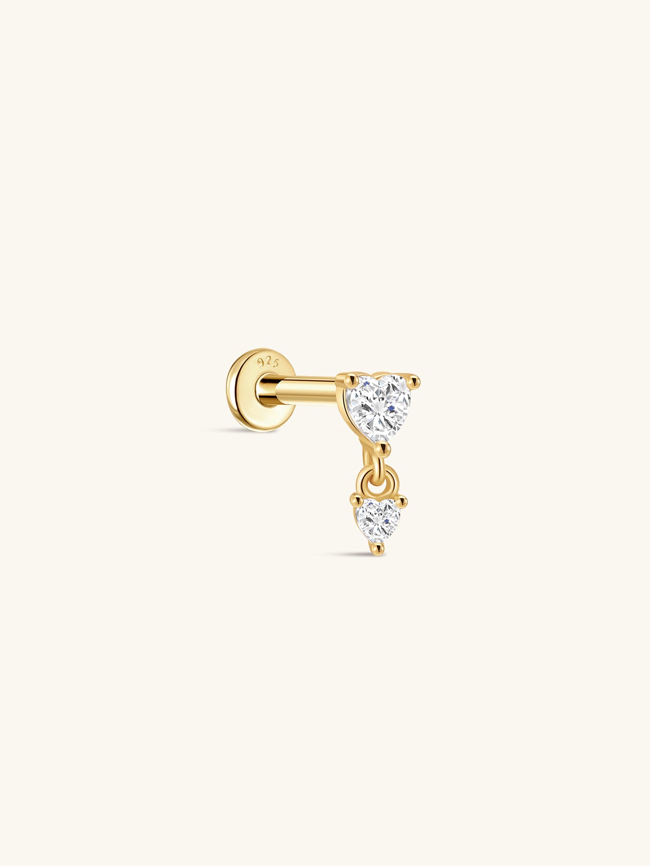 Gold plated sterling silver flat back labret stud with two dangling heart cubic zirconia stones.
