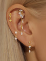 Gold plated 925 sterling silver earrings featuring marquise and diamond CZ charms, displayed on an ear.