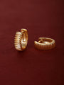 Two KOSINER Essentials gold-plated 925 sterling silver horizontal striped ribbed clicker hoops, inner band stamped 925, textured corrugated surface, shot on soft burgundy suede fabric