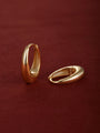 Matching pair of KOSINER Essentials gold-plated 925 sterling silver smooth oval drop clicker hoops, polished thick teardrop frame, inner band stamped 925, shot on soft burgundy suede fabric surface