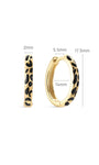 Side profile shot of KOSINER Puzzle 925 sterling silver leopard print clicker hoop, hinged snap closure structure, smooth gold-toned band with irregular black enamel leopard spots, easy to wear minimalist everyday hoop earring