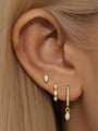 18K gold plated sterling silver marquise zirconia earring set on ear.