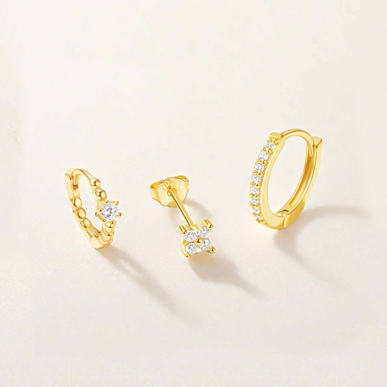 Gold plated 925 sterling silver earring set with flower pave zircon stud, beaded hoop, and pave zircon hoop.