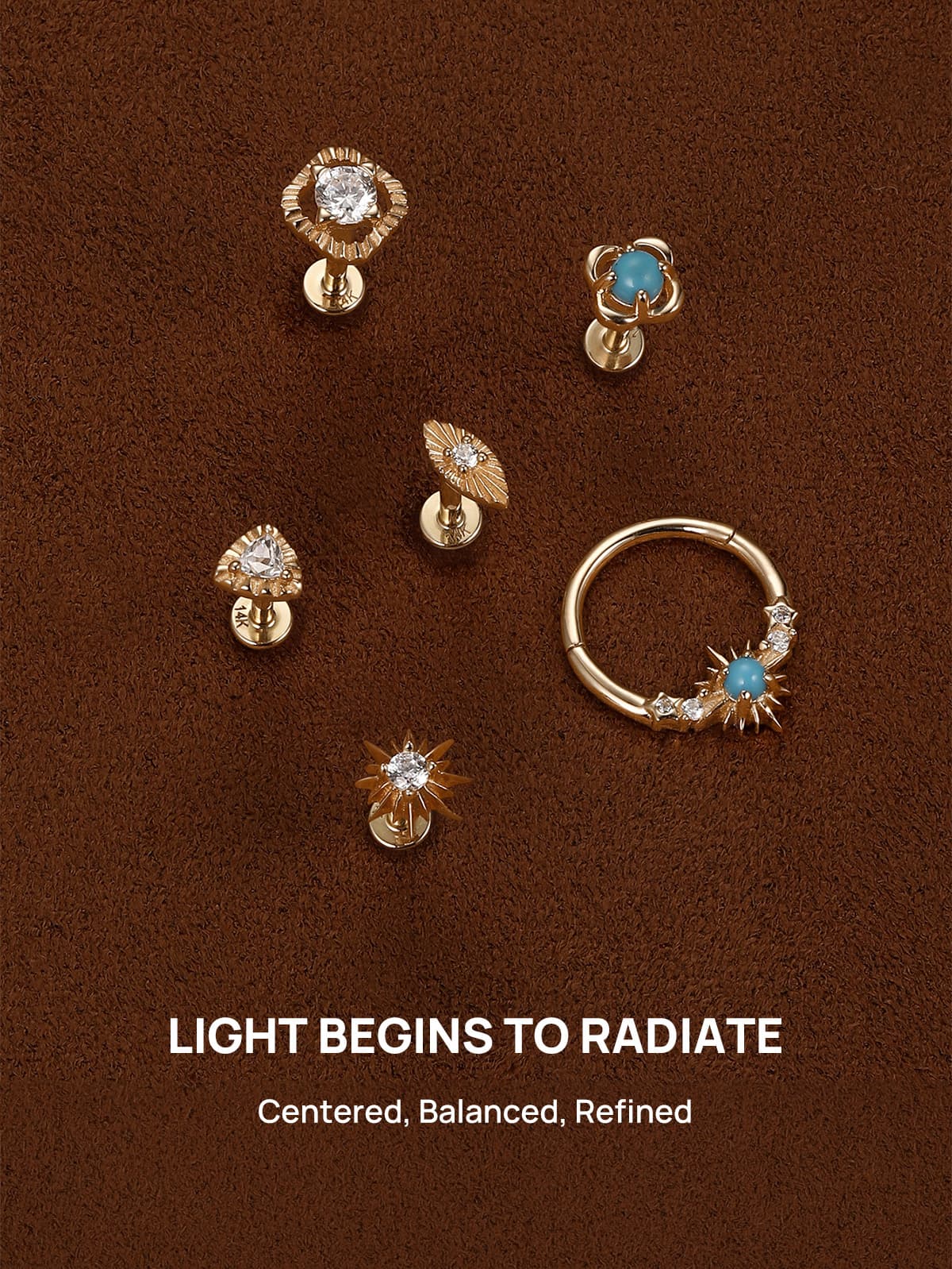 KOSINER Étoile radiance-themed piercing jewelry collection laid on brown suede, showcasing sunburst stud, hollow square, triangle, marquise, turquoise clover flat back studs and matching turquoise sun clicker hoop, centered balanced refined luminous design lineup