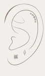 14K solid gold delicate lab-grown diamond ear piercing set styled on simple ear outline, featuring curved arc cartilage stud, round solitaire labret stud, marquise cut diamond flat back piercing, minimalist fine jewelry ear curation stack