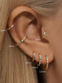 Gold titanium 16g cartilage hoops and cuff with colorful 5A CZ, showing sizes 6mm to 12mm on ear.