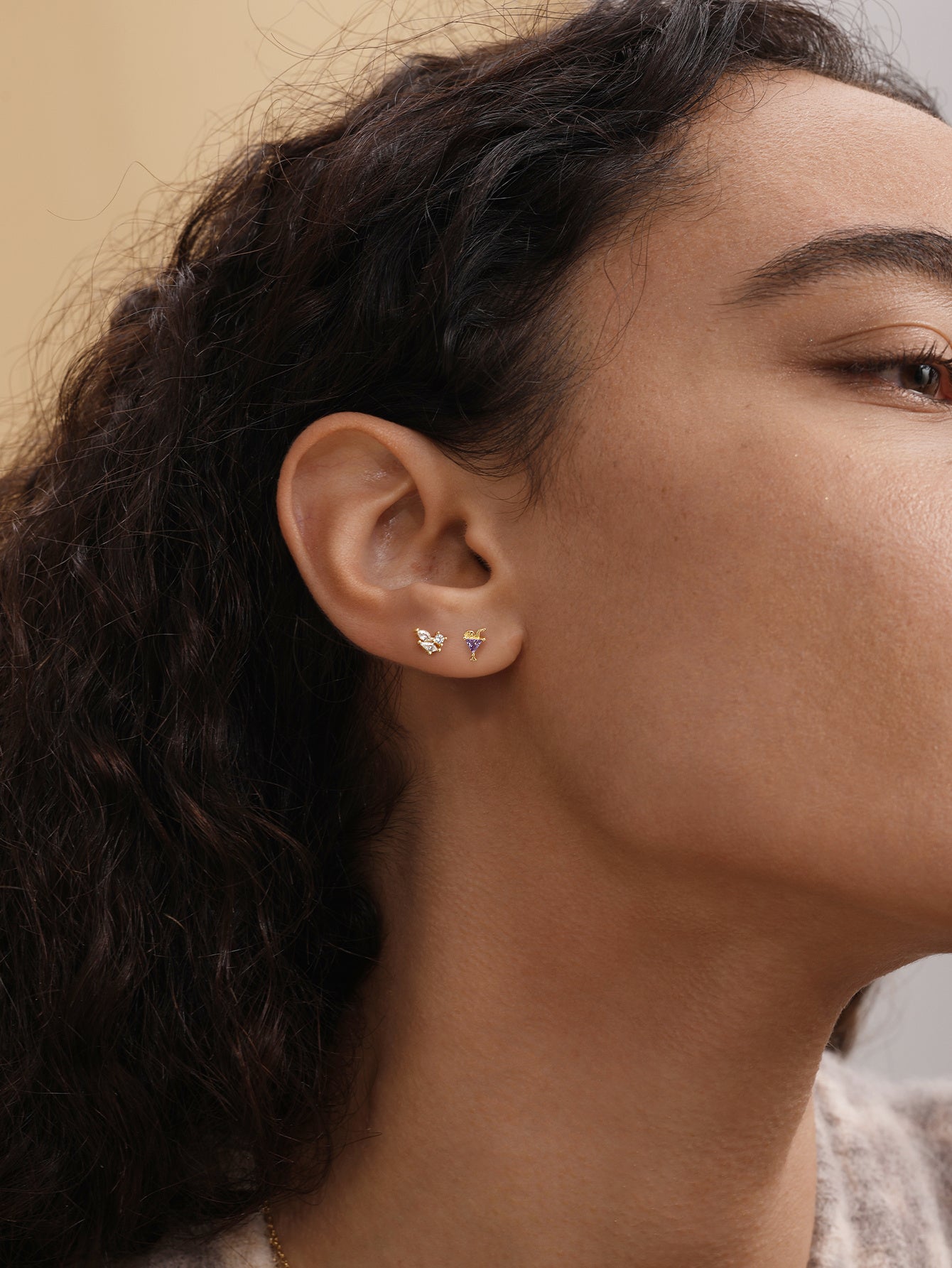 KOSINER cocktail glass stud paired with other ocean-themed piercings