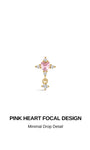 KOSINER Pink Ritual Pink Heart Cross Drop flat back stud, classic cross silhouette with central pink heart focal gem and minimal dangling crystal detail, romantic internally threaded piercing earring for ear stacking