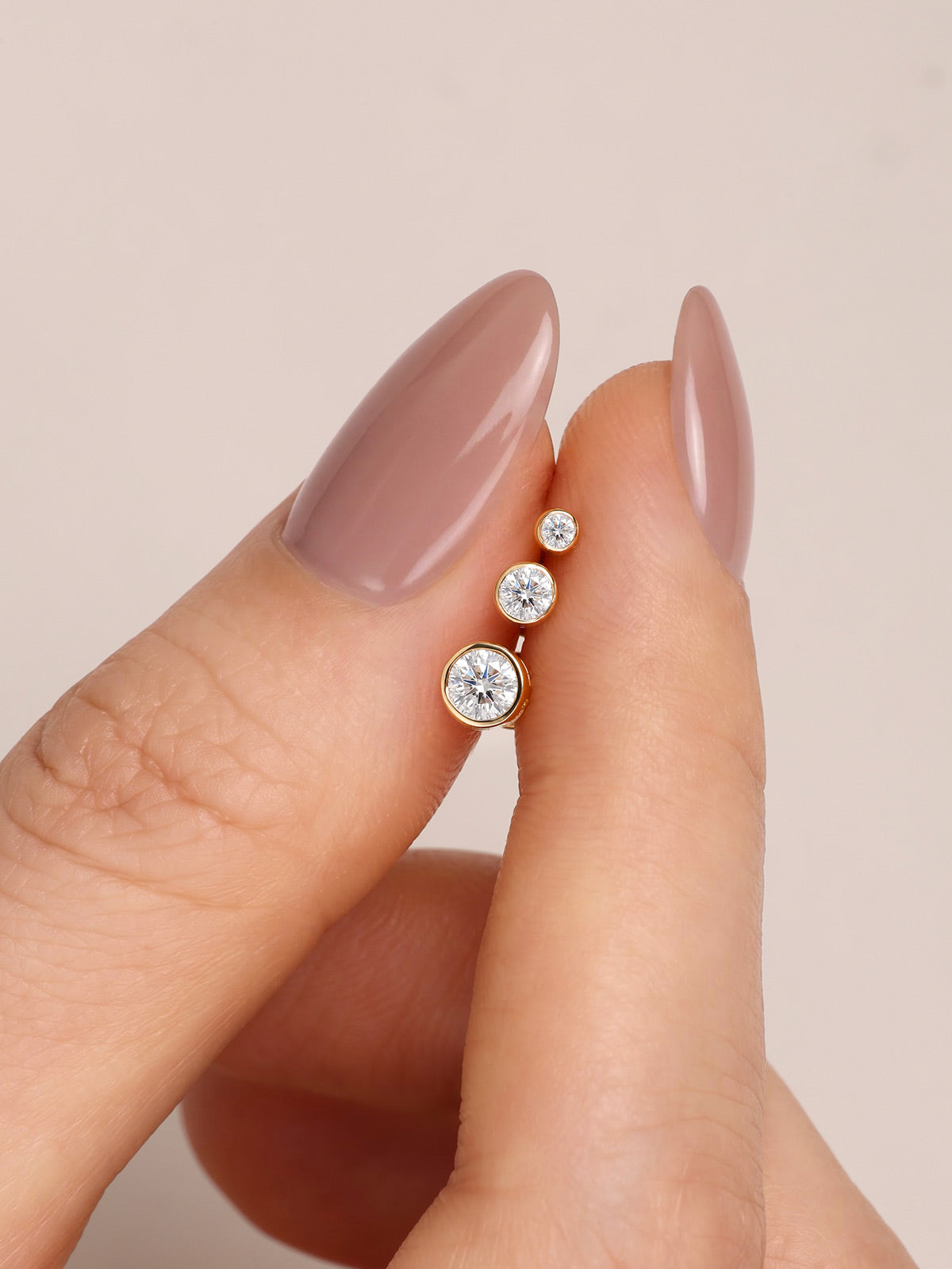 KOSINER round bezel lab-grown diamond flat back studs shown in three sizes