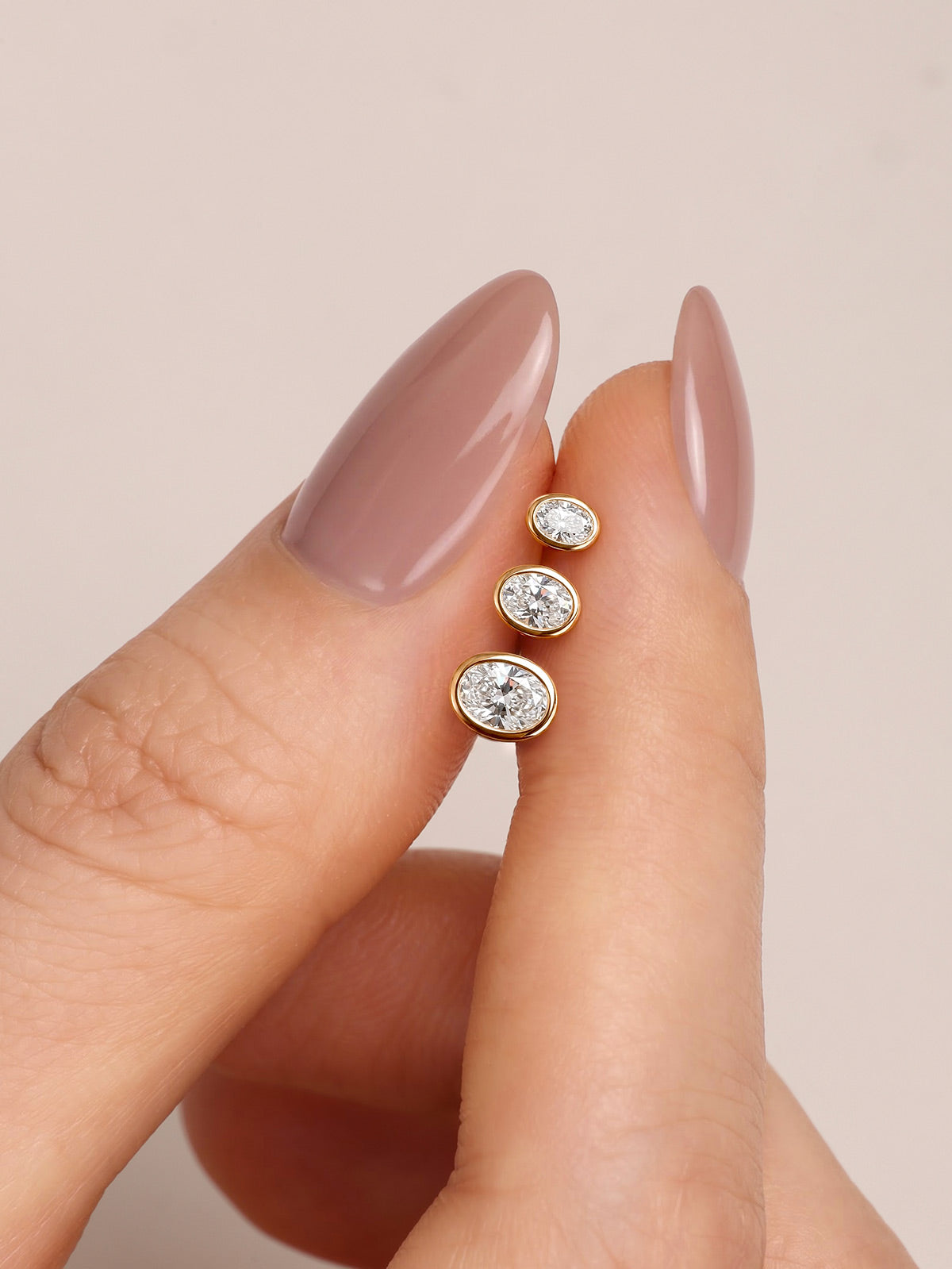 KOSINER oval bezel lab-grown diamond flat back studs shown in three sizes