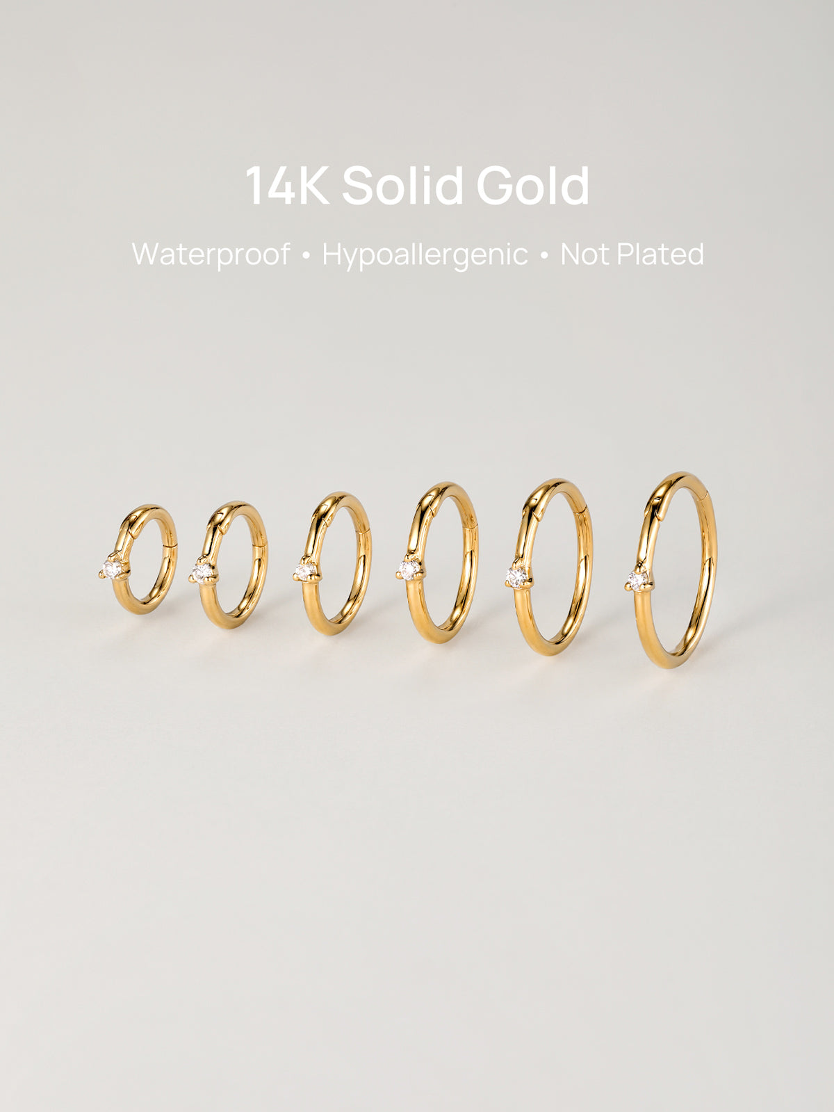 Studio lineup of all six sizes of KOSINER 14K solid gold diamond clicker hoops, header text: 14K Solid Gold, Waterproof, Hypoallergenic, Not Plated premium piercing jewelry