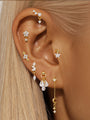 Assortment of 925 sterling silver gold plated earrings with cubic zirconia: flower, star, moon, teardrop designs.