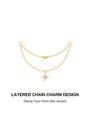 Étoile double-layer tassel chain front view, crafted in 18K gold vermeil, two delicate layered oval link chains, upper chain accented with a small bezel-set round clear cubic zirconia, lower chain finished with a dangling four-point star charm with central CZ stone, open loop ends designed to connect two piercings