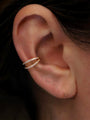 10mm 18K gold plated sterling silver double row hoop earring with cubic zirconia on ear.