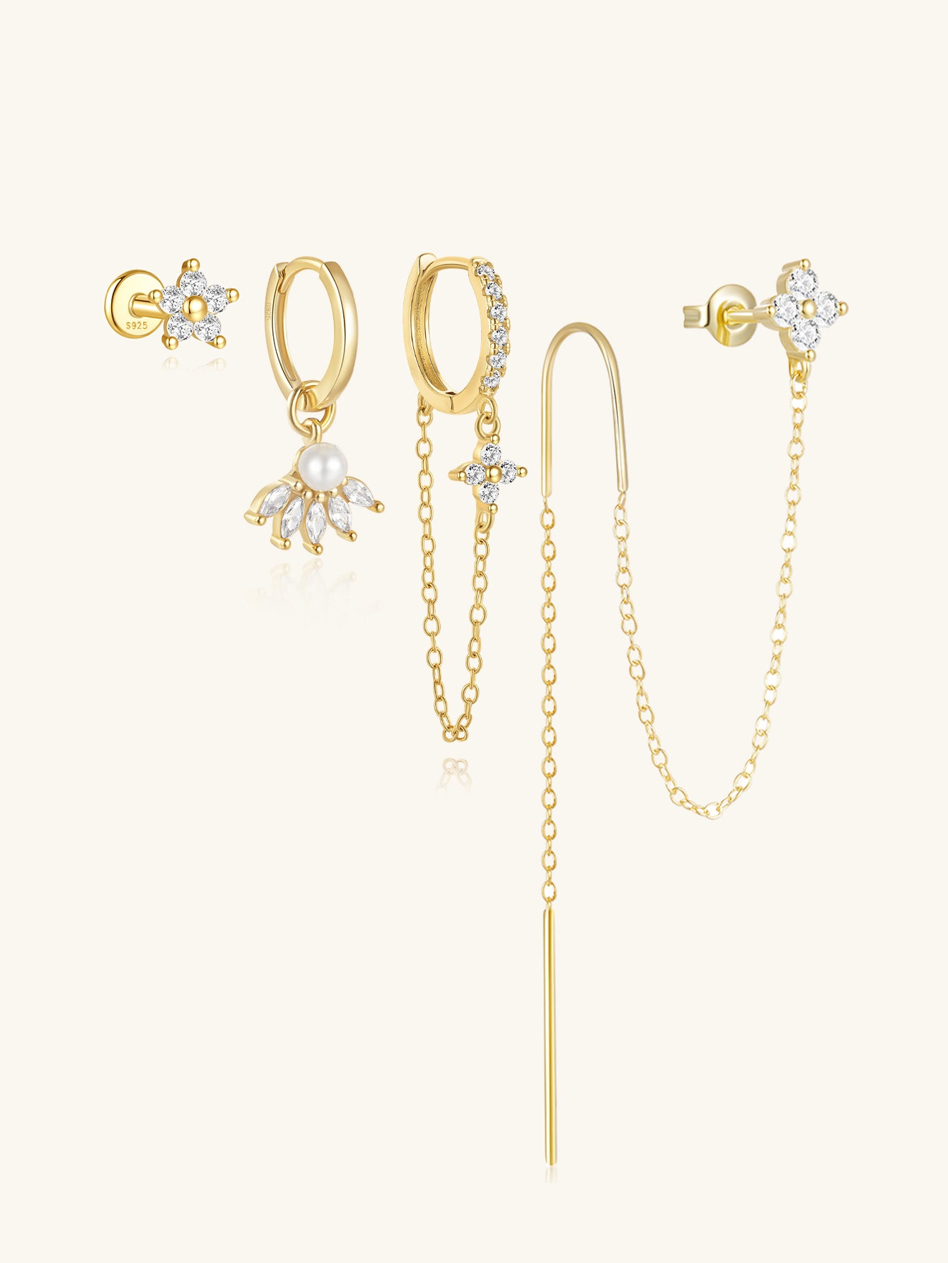 Four 18k gold plated sterling silver earrings with CZ and pearl: clover studs, dangle, and chain designs.