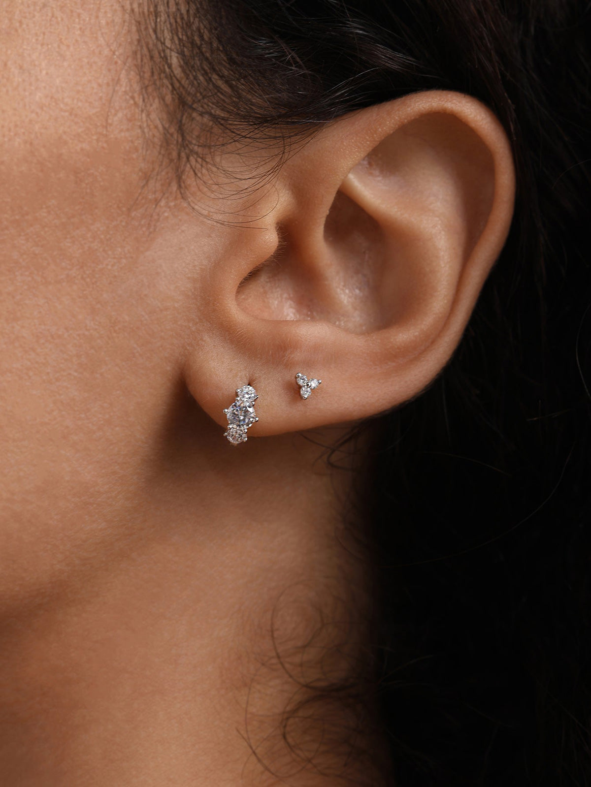 KOSINER 14K solid gold minimalist trinity stud worn solo or layered in curated ear stack