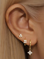 Gold plated sterling silver earrings: stud, floral hoop, and floral dangle with cubic zirconia stones.