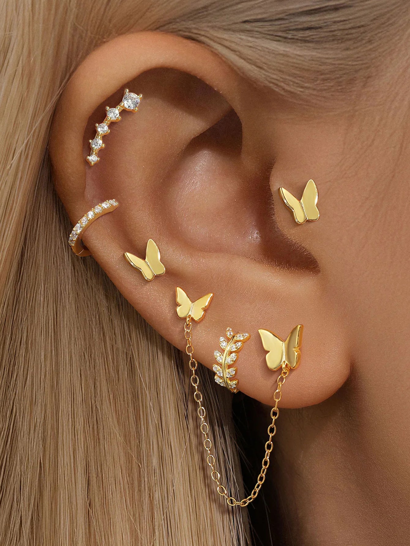 Gold 925 sterling silver earrings with butterfly studs, CZ ear cuff, and chain-linked butterfly jacket.