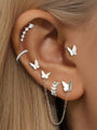 Kosiner 925 Sterling silver Zircon earring stack on ear: butterfly studs, CZ climber, leaf stud, chain-linked butterfly jacket.