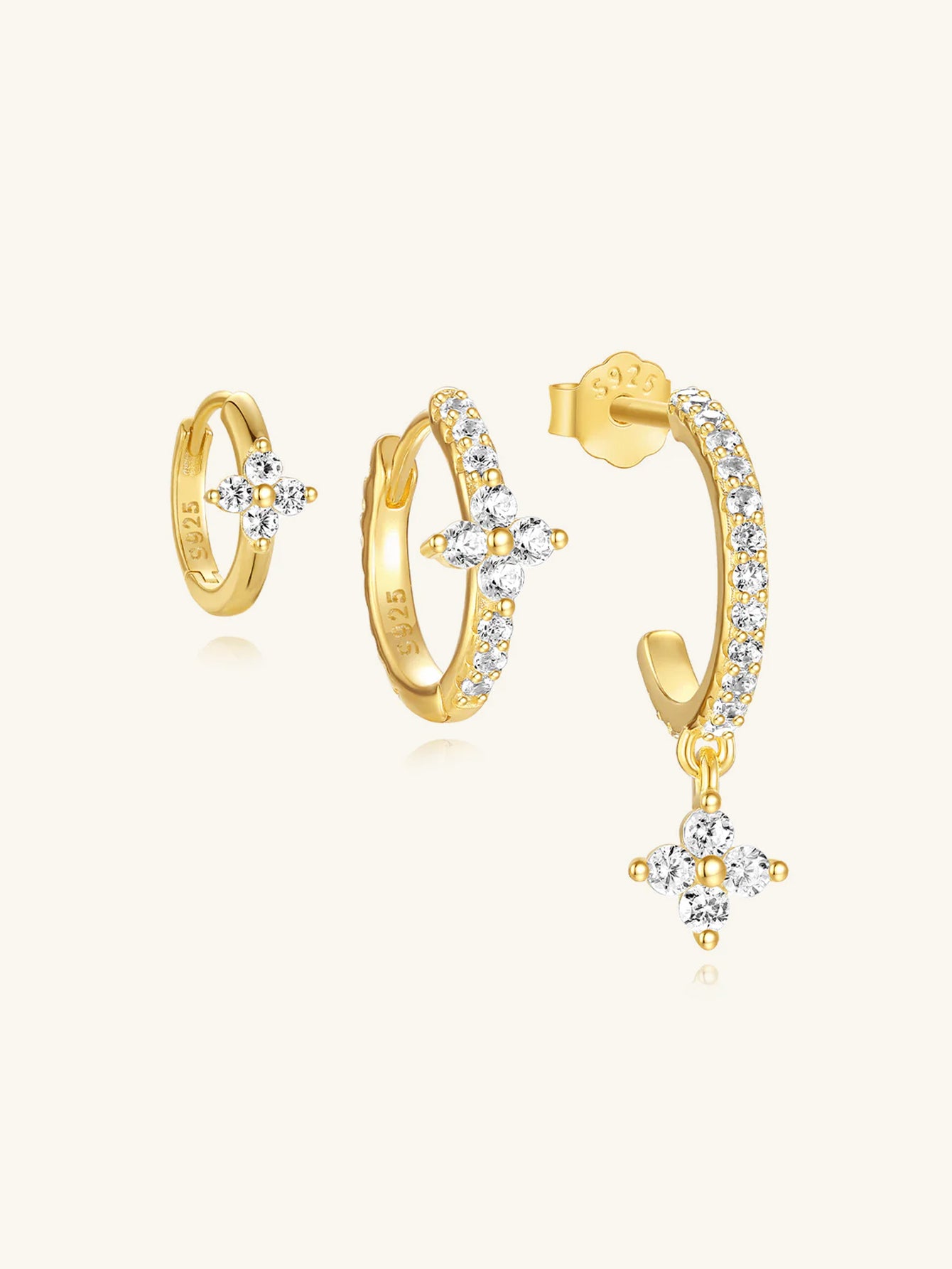 Set of 18k gold plated sterling silver earrings with floral pave cubic zirconia, including hoop and dangle designs.