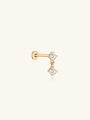 14K solid gold stud earring with a dangling chain and two prong-set cubic zirconia stones, flat back closure.