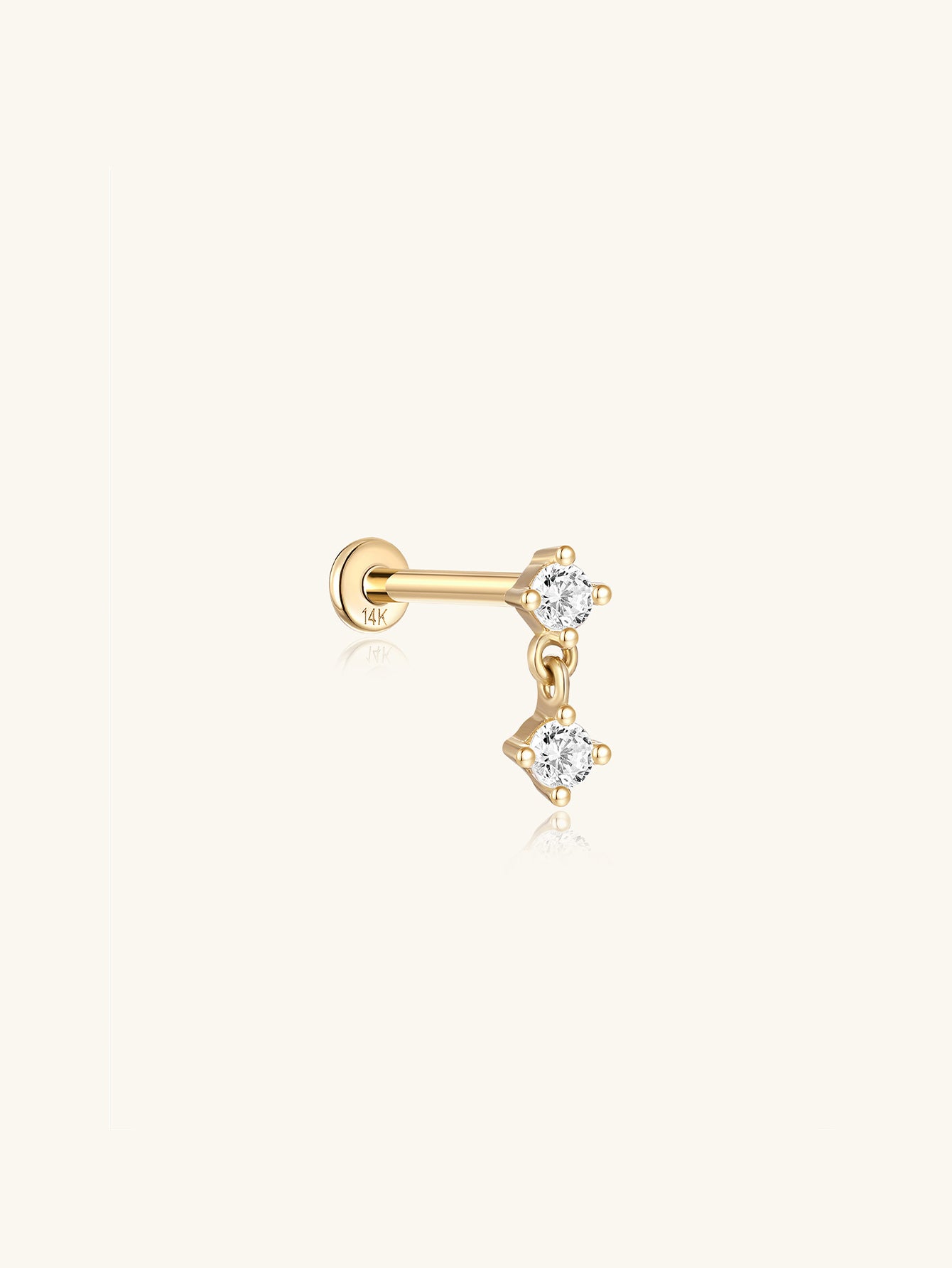 14K solid gold stud earring with a dangling chain and two prong-set cubic zirconia stones, flat back closure.
