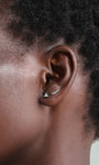 14K gold trinity stud piercing with cubic zirconia, and curved bar piercing on ear.