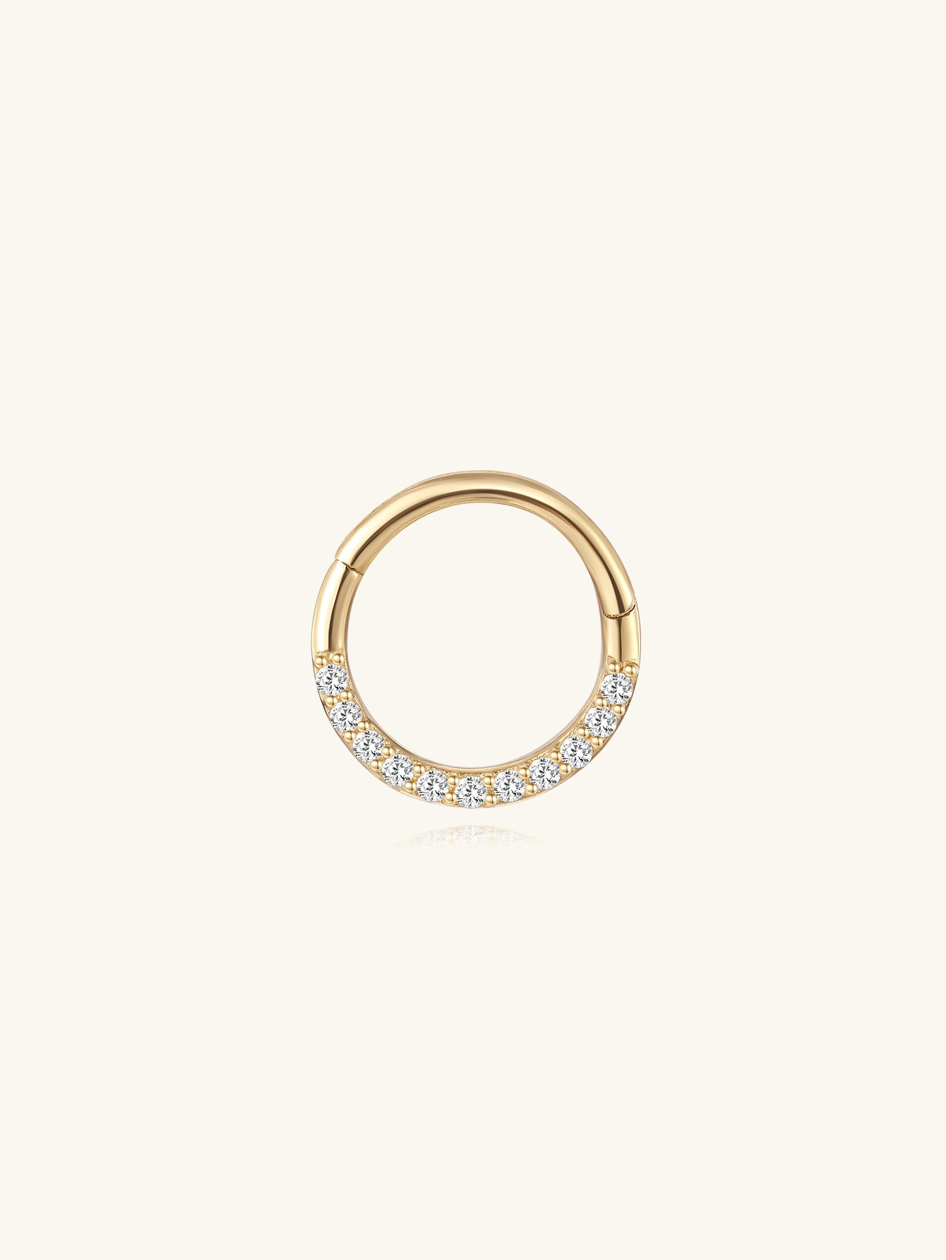 14K solid gold hoop earring with pave cubic zirconia crystals on a light background.