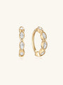 14K solid gold hinged segment hoop ring with four marquise-cut cubic zirconia crystals.