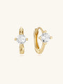 14K solid gold mini huggie hoop earring with a sparkling cubic zirconia stone, 6mm inner diameter. Product appearance.